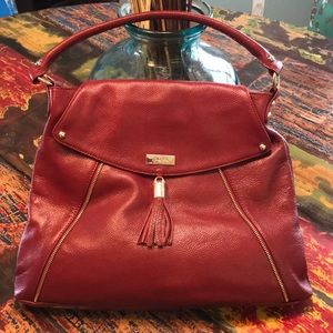 Leather, tasseled handbag, never used